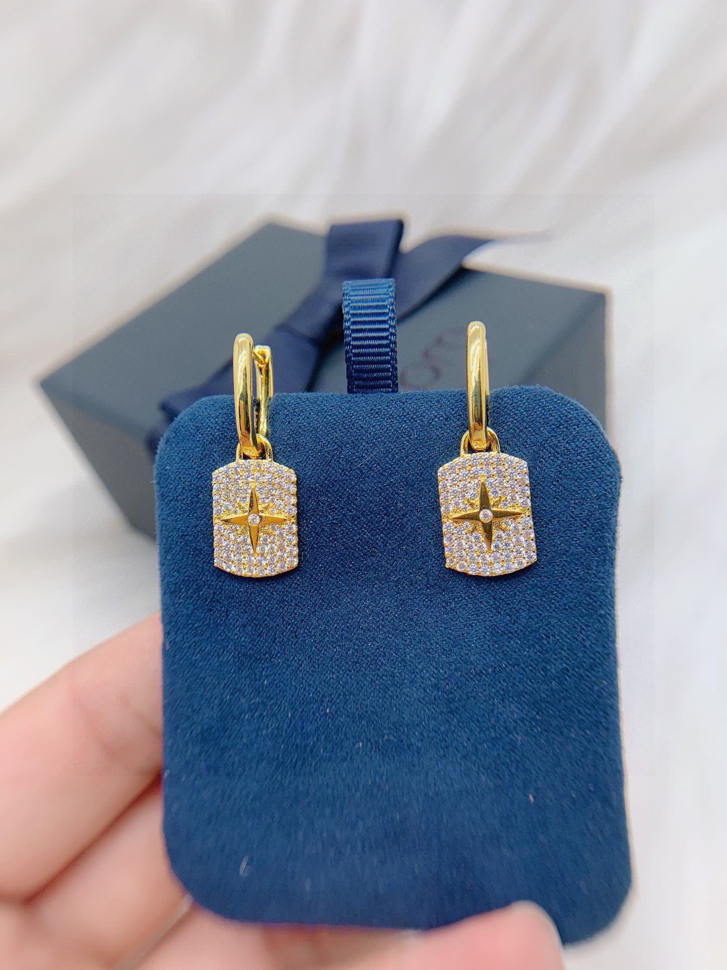 APM Monaco Elegant Gold and Diamond Star Earrings